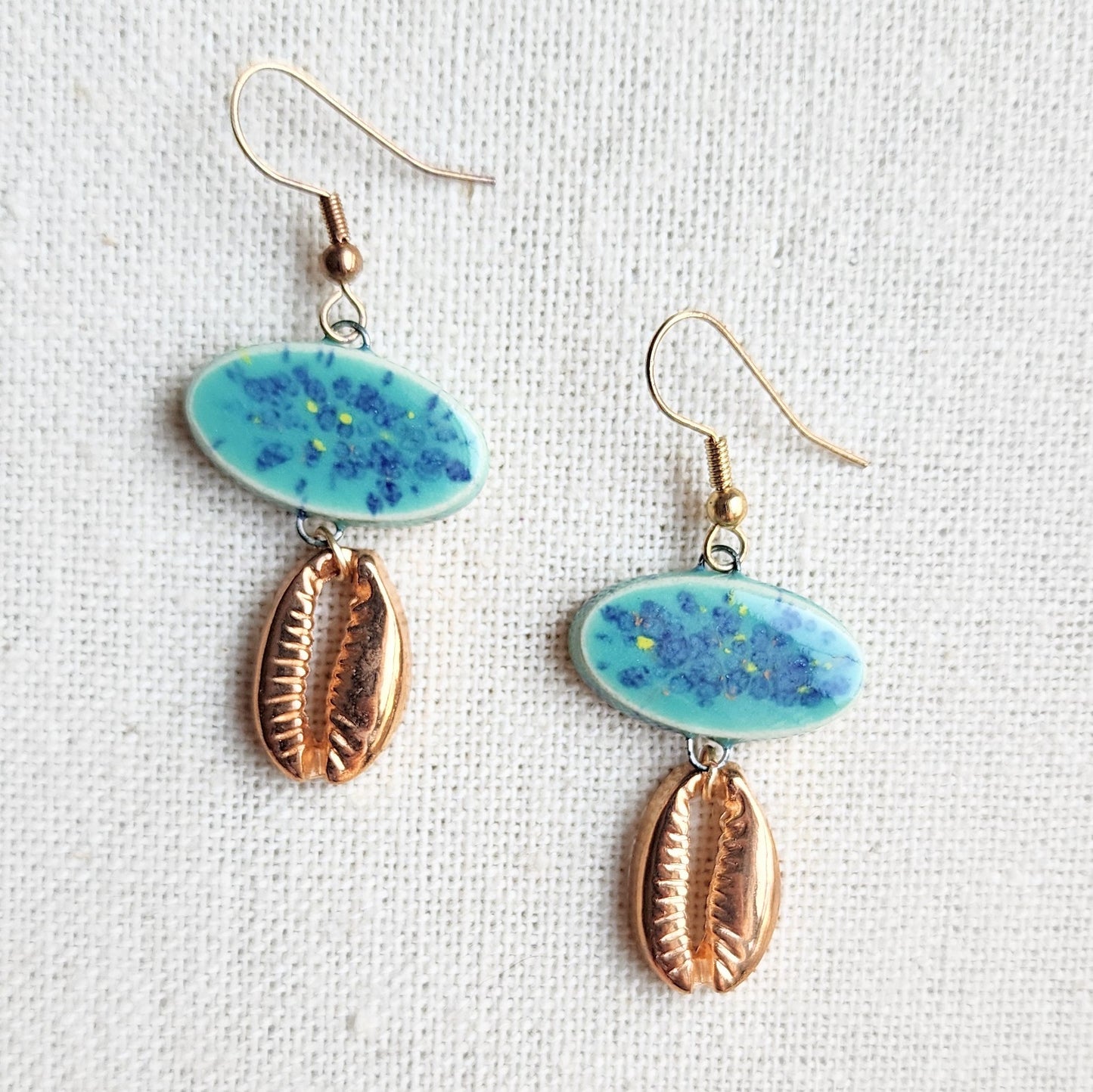 Handmade Ceramic Teal Speckled Earrings With Goldtone Cowrie Shell