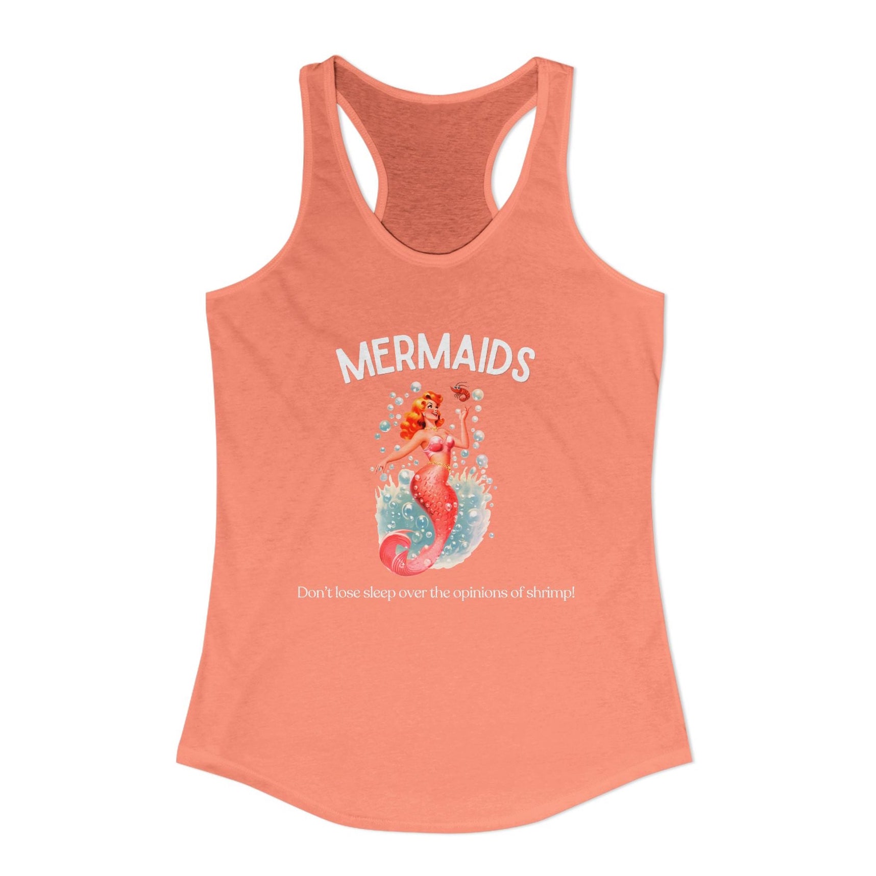 A coral pink racerback tank top featuring a mermaid graphic on the front with the text 'MERMAIDS' and 'Don't lose sleep over the opinions of shrimp!' on a plain white background.