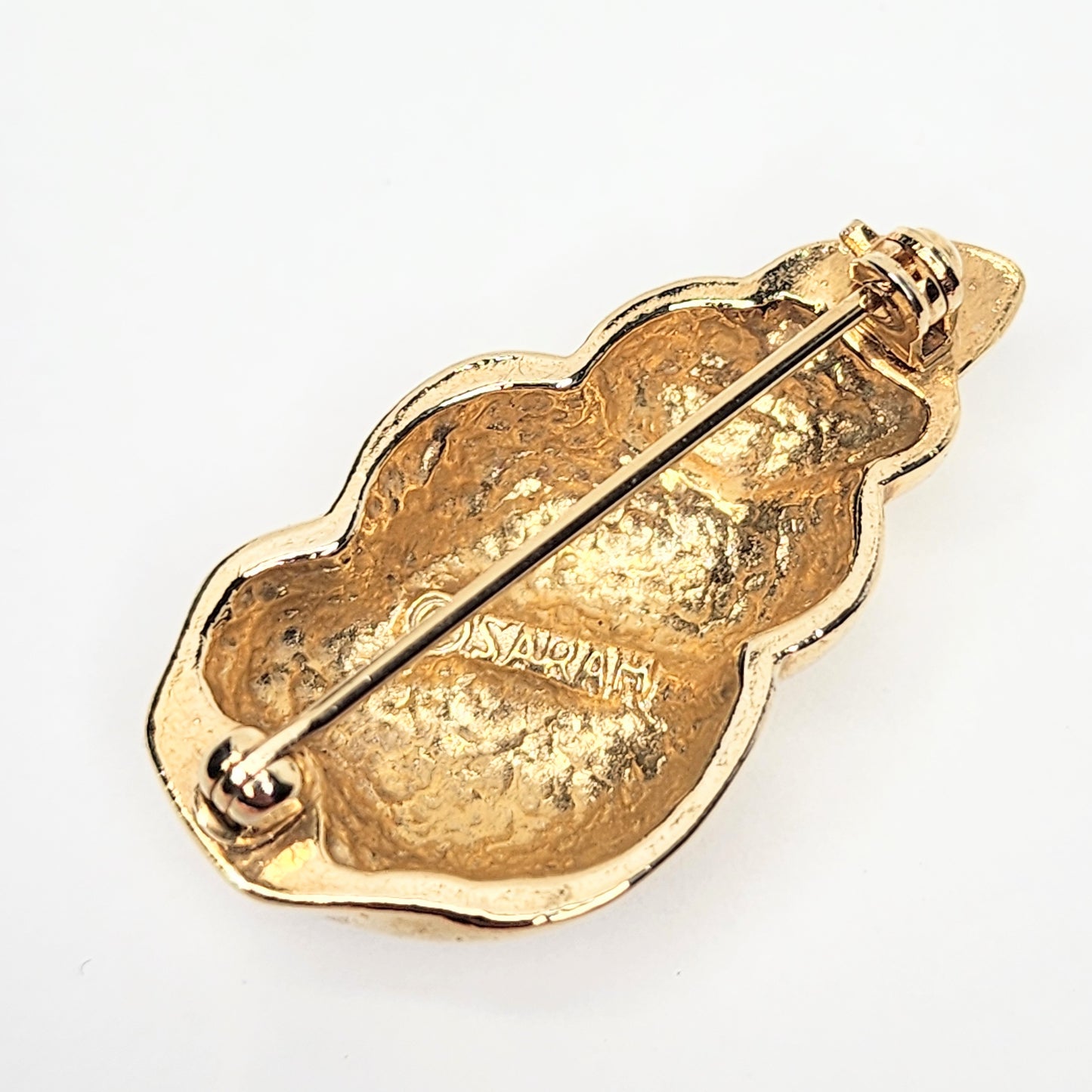Vintage Sarah Coventry spiral seashell brooch pin